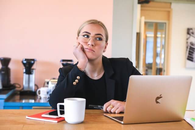 Picture of lady being bored on a meeting